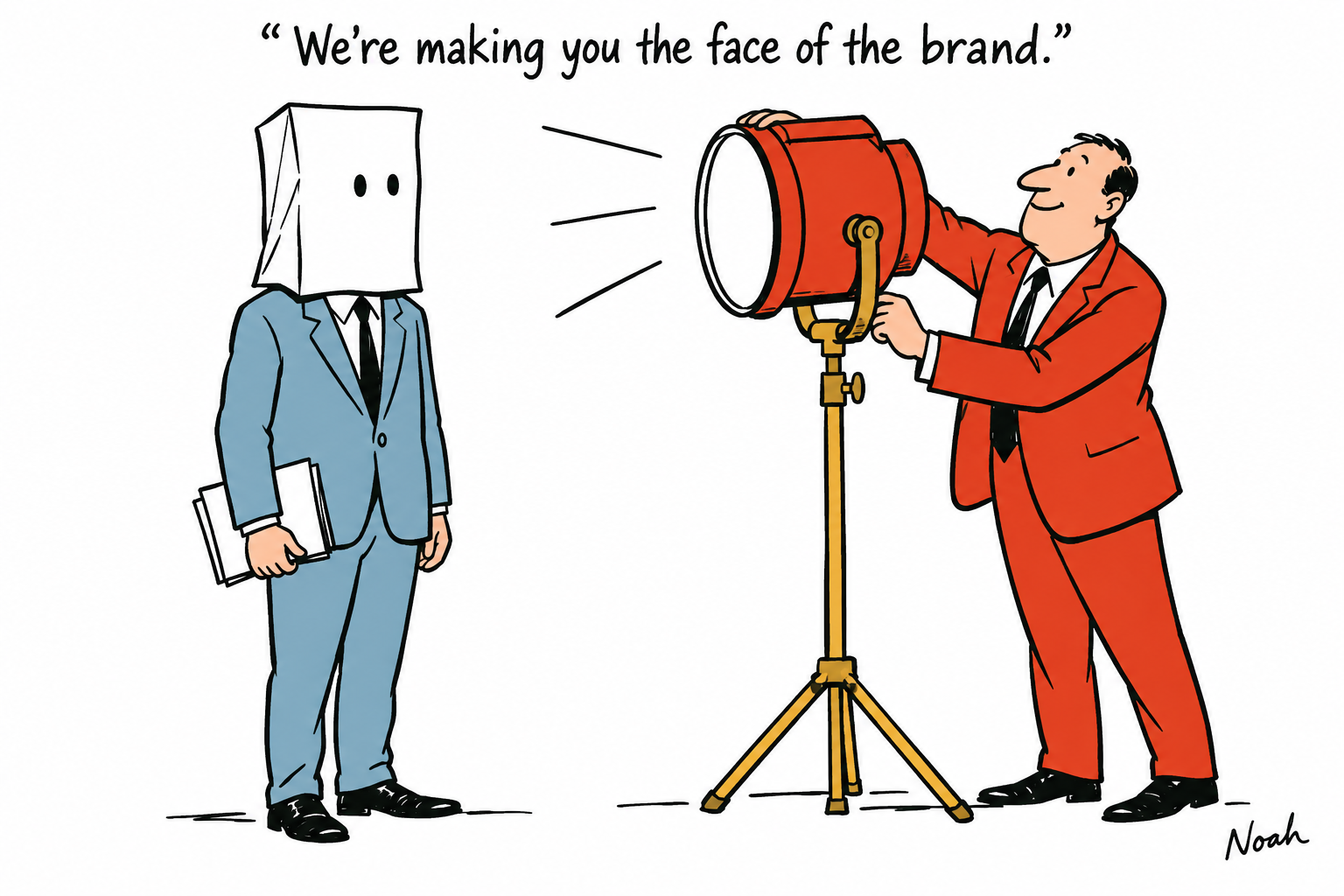 A publisher aims a large red spotlight at a journalist whose head is concealed by a plain paper bag with eyeholes.